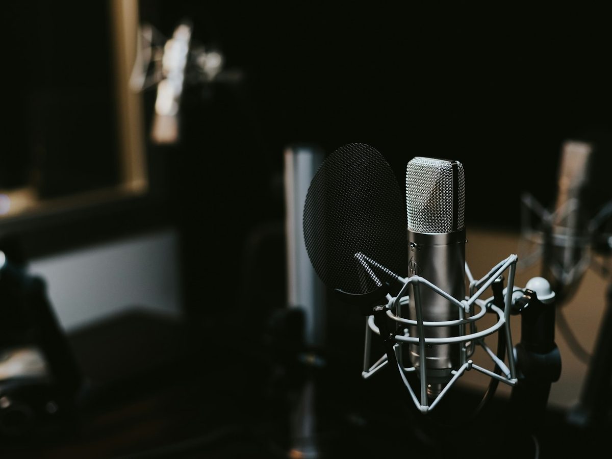 A studio microphone in a treated recording booth